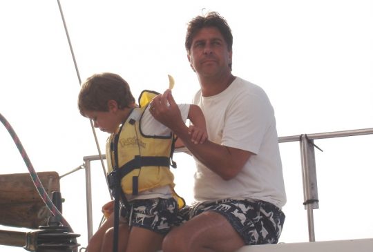 son-and-father-on-boat